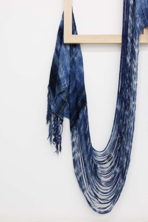 Weaving (long enough), 2024. Handwoven, indigo-dyed cotton, hand-dyed tensel, maple, 26 1/4 x 70 x 1.5 in