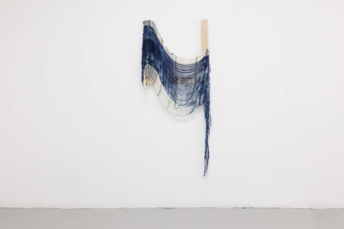 Weaving (release), 2024, Handwoven, indigo-dyed cotton, hand-dyed tensel, maple, 26 x 61 x 1.5 in