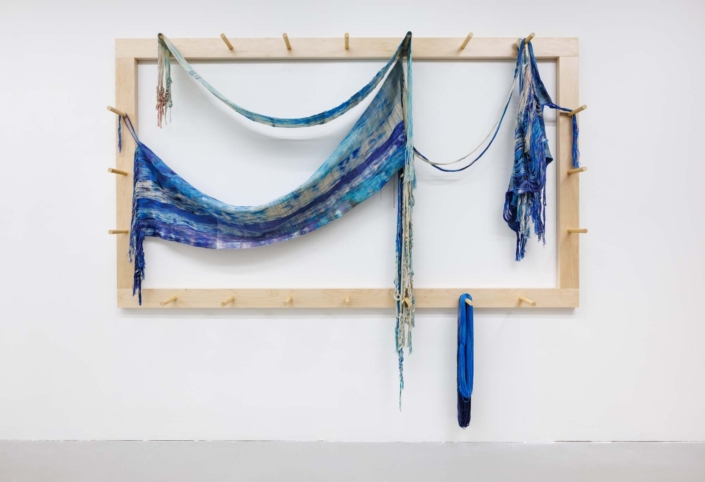 Weaving (Pulling through), 2026, Maple wood, Hand-woven and dyed cotton, rayon, 96 x 8 x 80 in. 